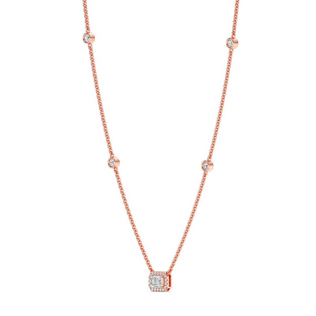 Elegant Emerald-Cut Lab-Grown Diamond Station Necklace in 18K Rose Gold showcasing a bezel-set 1.00-carat emerald-cut diamond with halo and stationed round diamonds for added brilliance.