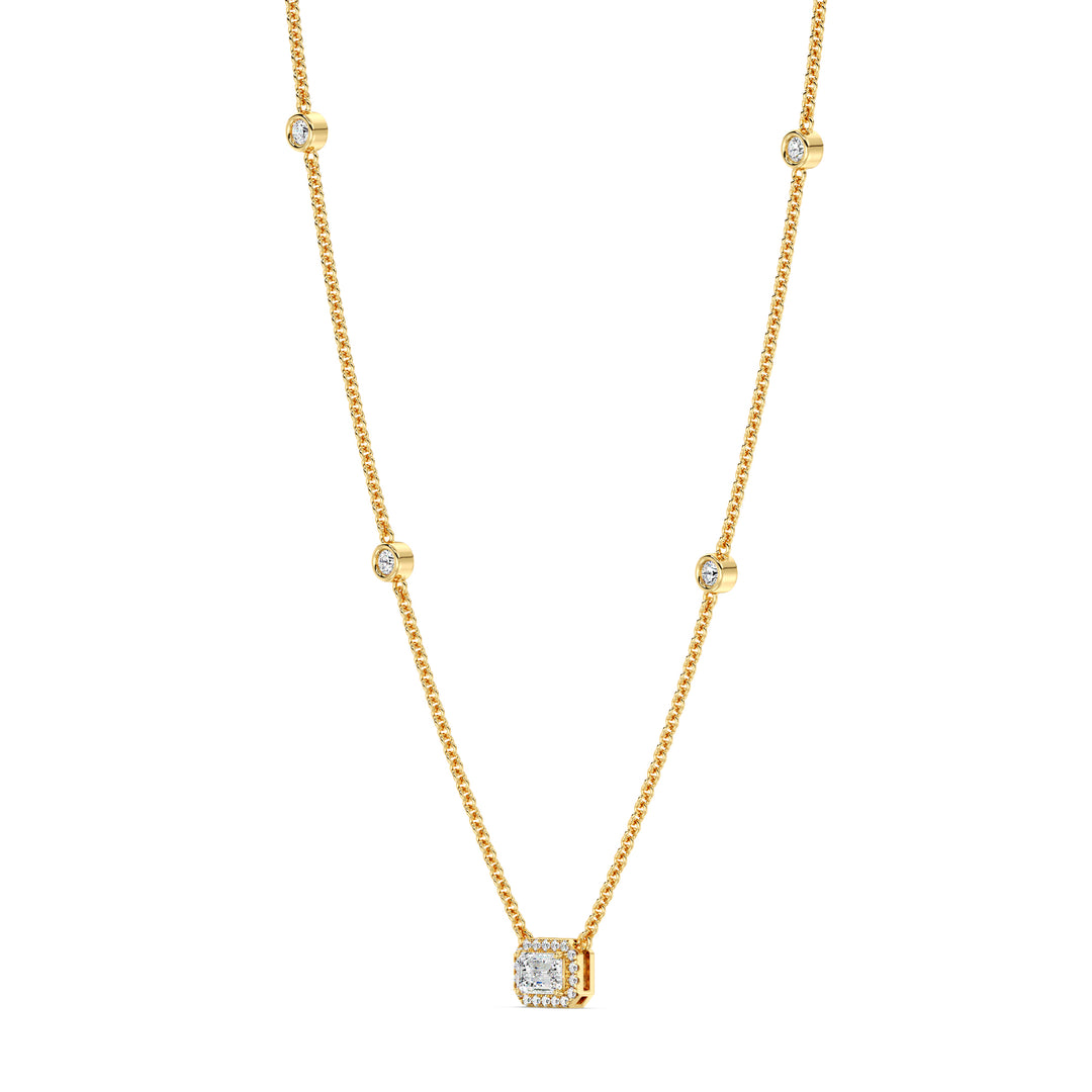 Elegant Emerald-Cut Lab-Grown Diamond Station Necklace in 18K Yellow Gold featuring a bezel-set 1.00-carat emerald-cut diamond with halo and stationed round diamonds along the chain.