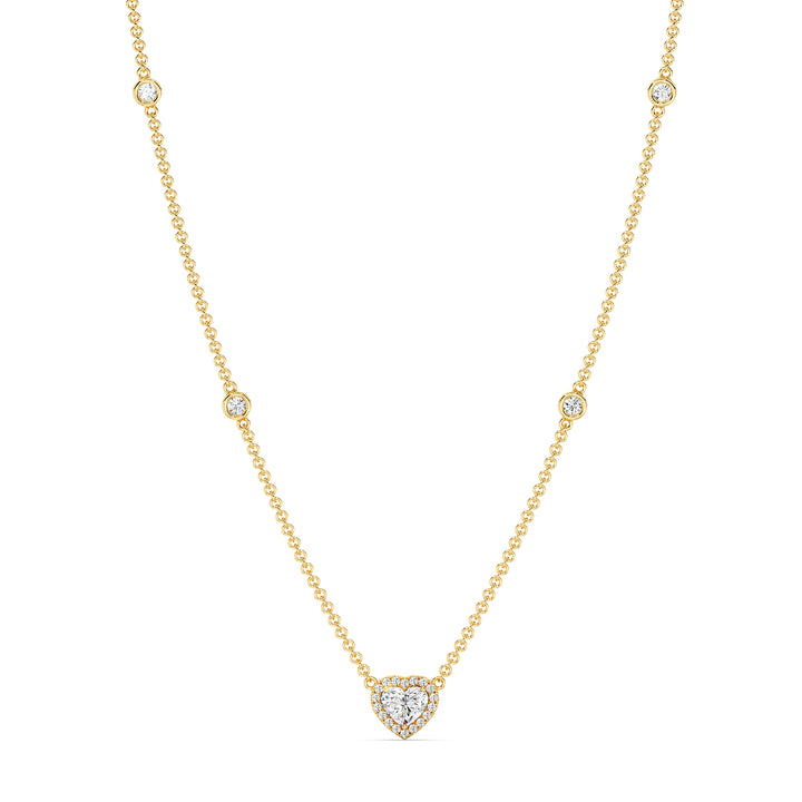 Elegant Heart Diamond Accent Halo & Bezel Station Necklace in 18K Yellow Gold featuring a 1.00ct heart-cut lab-grown diamond surrounded by a halo of smaller EF/VS diamonds and a bezel-set diamond-accented chain