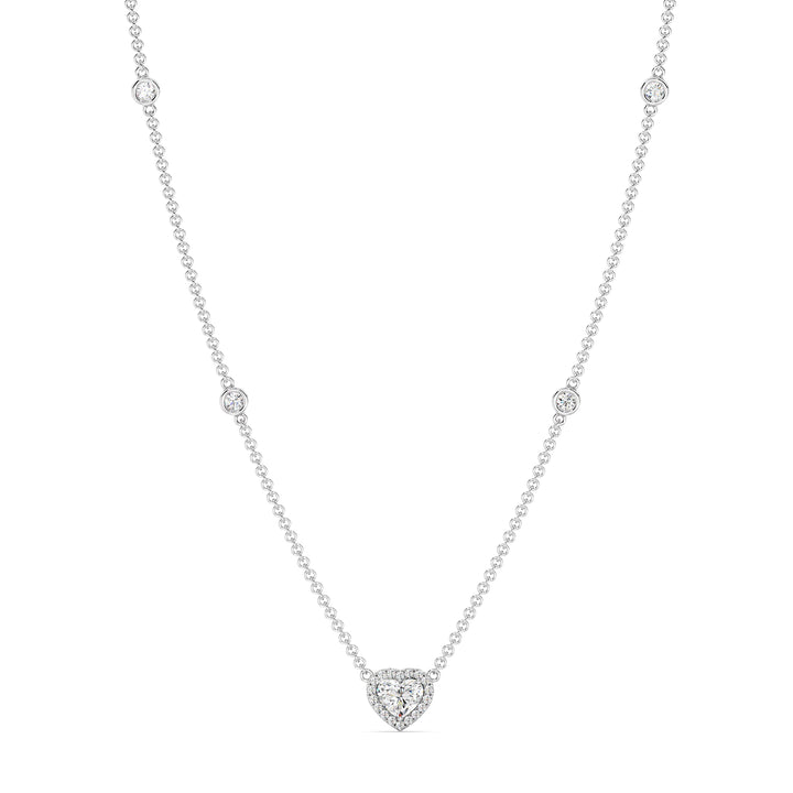 Elegant Heart Diamond Accent Halo & Bezel Station Necklace in 18K White Gold with a central 1.00ct heart-cut lab-grown diamond surrounded by a halo of smaller EF/VS diamonds and a bezel-set diamond-accented chain.