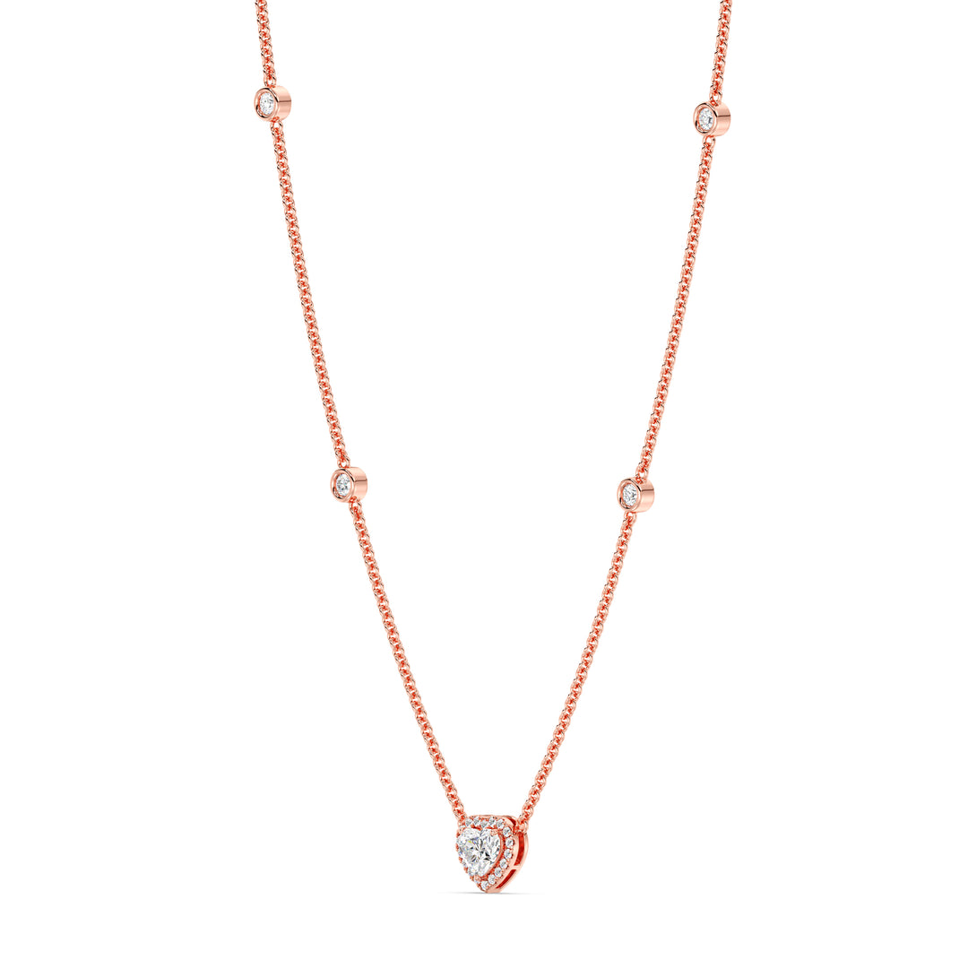 Elegant Heart Diamond Accent Halo & Bezel Station Necklace in 18K Rose Gold showcasing a 1.00ct heart-cut lab-grown diamond framed by a halo of EF/VS diamonds with a diamond-accented chain
