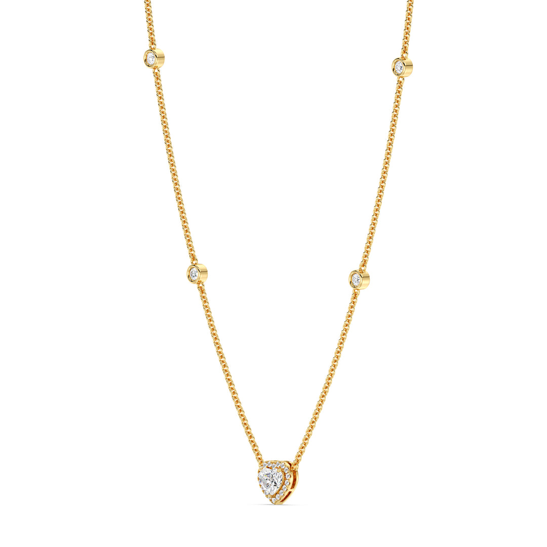 Elegant Heart Diamond Accent Halo & Bezel Station Necklace in 18K Yellow Gold featuring a 1.00ct heart-cut lab-grown diamond surrounded by a halo of smaller EF/VS diamonds and a bezel-set diamond-accented chain