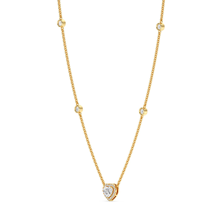 Elegant Heart Diamond Accent Halo & Bezel Station Necklace in 18K Yellow Gold featuring a 1.00ct heart-cut lab-grown diamond surrounded by a halo of smaller EF/VS diamonds and a bezel-set diamond-accented chain