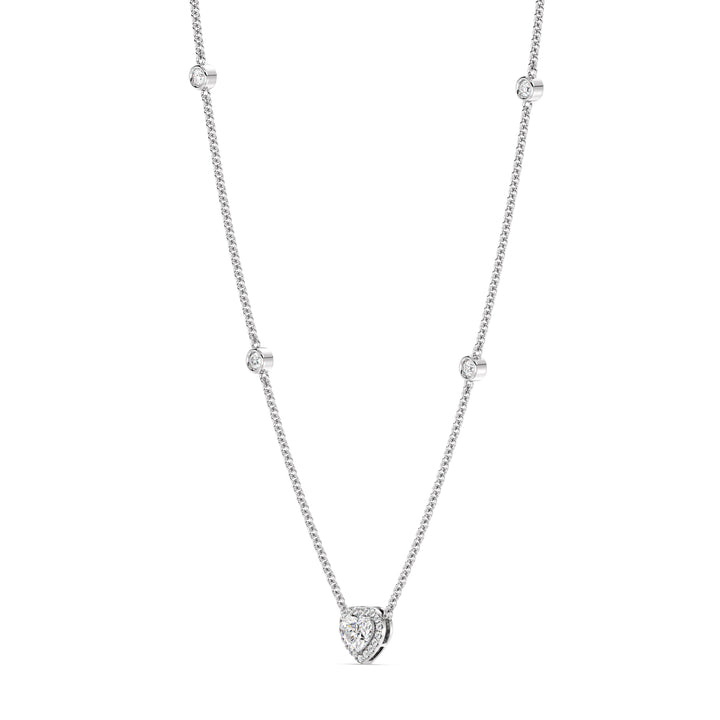 Elegant Heart Diamond Accent Halo & Bezel Station Necklace in 18K White Gold with a central 1.00ct heart-cut lab-grown diamond surrounded by a halo of smaller EF/VS diamonds and a bezel-set diamond-accented chain.