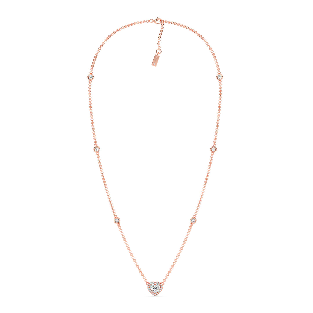 Elegant Heart Diamond Accent Halo & Bezel Station Necklace in 18K Rose Gold showcasing a 1.00ct heart-cut lab-grown diamond framed by a halo of EF/VS diamonds with a diamond-accented chain