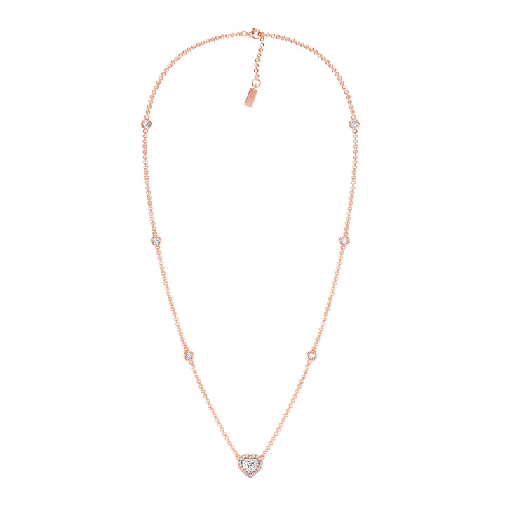 Elegant Heart Diamond Accent Halo & Bezel Station Necklace in 18K Rose Gold showcasing a 1.00ct heart-cut lab-grown diamond framed by a halo of EF/VS diamonds with a diamond-accented chain