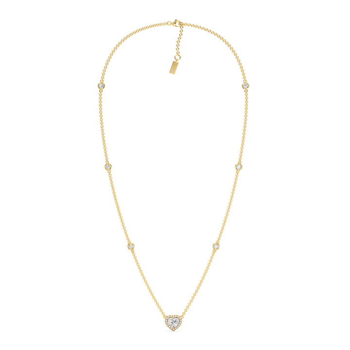 Elegant Heart Diamond Accent Halo & Bezel Station Necklace in 18K Yellow Gold featuring a 1.00ct heart-cut lab-grown diamond surrounded by a halo of smaller EF/VS diamonds and a bezel-set diamond-accented chain