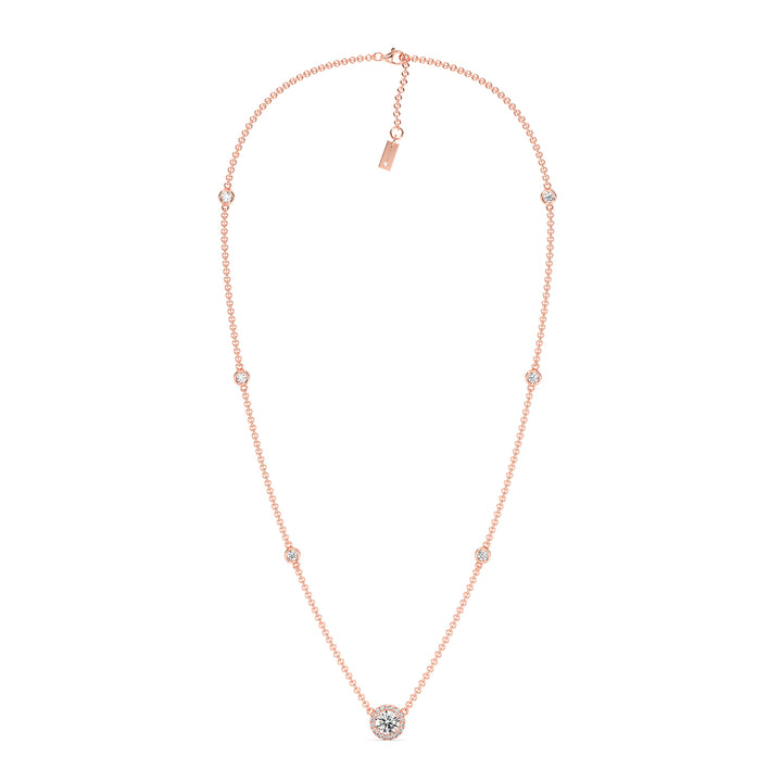 18K rose gold Round Diamond Accent Halo Bezel Station Necklace with a 1.00ct IGI Certified lab-grown diamond at the center, surrounded by EF/VS halo diamonds and bezel-set diamonds along the chain