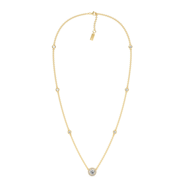 18K yellow gold Round Diamond Accent Halo Bezel Station Necklace featuring a 1.00ct IGI Certified lab-grown diamond at the center with a halo of smaller EF/VS diamonds and additional bezel-set diamonds on the chain