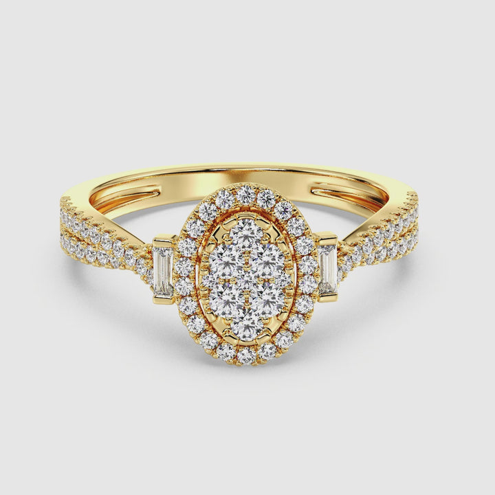 Close-up video showcasing the 18K Yellow Gold Oval Cluster Halo Engagement Ring with 0.67 CTW lab-grown diamonds. The ring features a dazzling oval cluster halo design with round and baguette diamonds, set in vibrant yellow gold. The video highlights the brilliance of the EF color diamonds and the elegant craftsmanship, making it a timeless and sustainable choice for an engagement ring.
