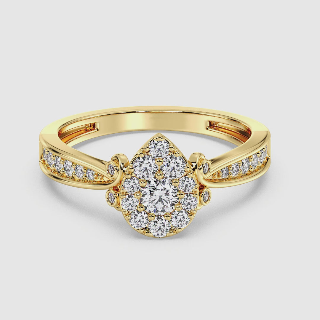 Video showcasing a stunning 18K yellow gold pear-shaped cluster halo engagement ring with 0.70 CTTW round EF-VS lab-grown diamonds. The ring sparkles brilliantly as it rotates, highlighting its exquisite craftsmanship, elegant pear-shaped halo design, and warm yellow gold finish. Perfect for celebrating timeless love and commitment.