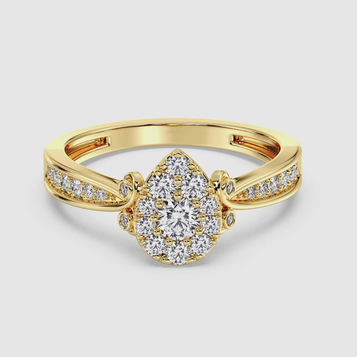 Video showcasing a stunning 18K yellow gold pear-shaped cluster halo engagement ring with 0.70 CTTW round EF-VS lab-grown diamonds. The ring sparkles brilliantly as it rotates, highlighting its exquisite craftsmanship, elegant pear-shaped halo design, and warm yellow gold finish. Perfect for celebrating timeless love and commitment.