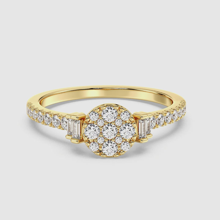 Close-up video of an 18K yellow gold engagement ring featuring 0.57 carats of lab-grown round and baguette diamonds. The ring sparkles beautifully as it rotates, showcasing its elegant design and detailed craftsmanship.