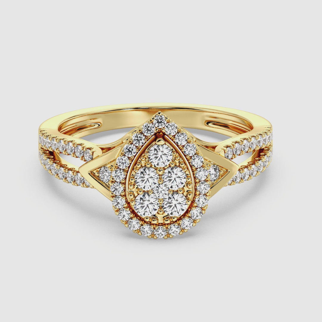 Video showcasing a stunning 18K Yellow Gold Pear-Shaped Engagement Ring featuring a 0.56CT round-cut lab-grown diamond. The ring sparkles with 62 meticulously placed diamonds, highlighting its EF color and VS clarity. The warm yellow gold setting enhances the brilliance and elegance of this timeless design, perfect for celebrating everlasting love