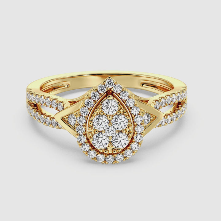 Video showcasing a stunning 18K Yellow Gold Pear-Shaped Engagement Ring featuring a 0.56CT round-cut lab-grown diamond. The ring sparkles with 62 meticulously placed diamonds, highlighting its EF color and VS clarity. The warm yellow gold setting enhances the brilliance and elegance of this timeless design, perfect for celebrating everlasting love