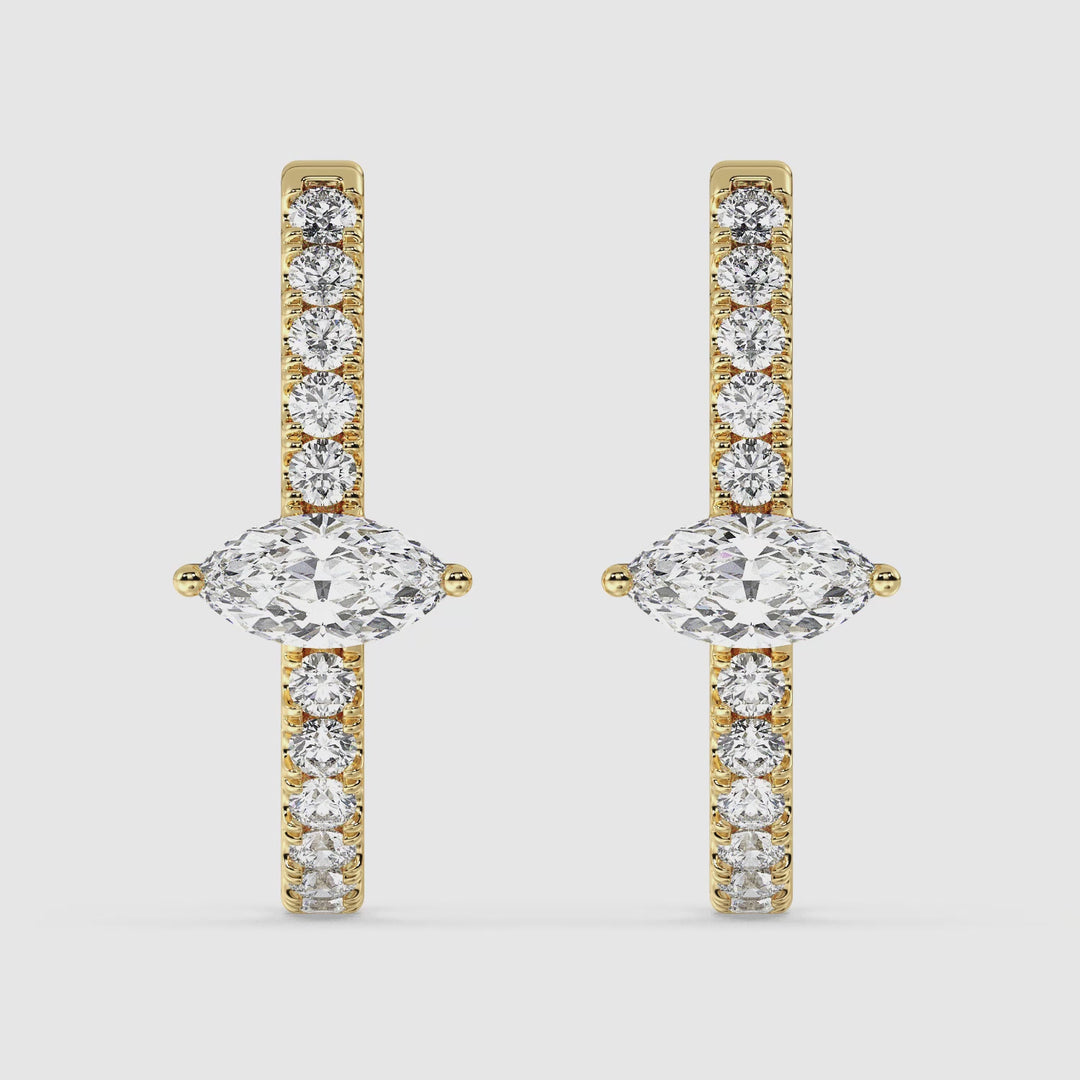Close-up video showcasing the Yellow Gold variant of the 18K Gold Triple Hoop Huggie Earrings, adorned with shimmering lab-grown diamonds. The intricate design highlights pear and round-cut diamonds set in three elegant hoops, capturing their radiant sparkle from multiple angles. The lightweight and luxurious earrings are displayed to emphasize their craftsmanship, timeless beauty, and comfortable fit
