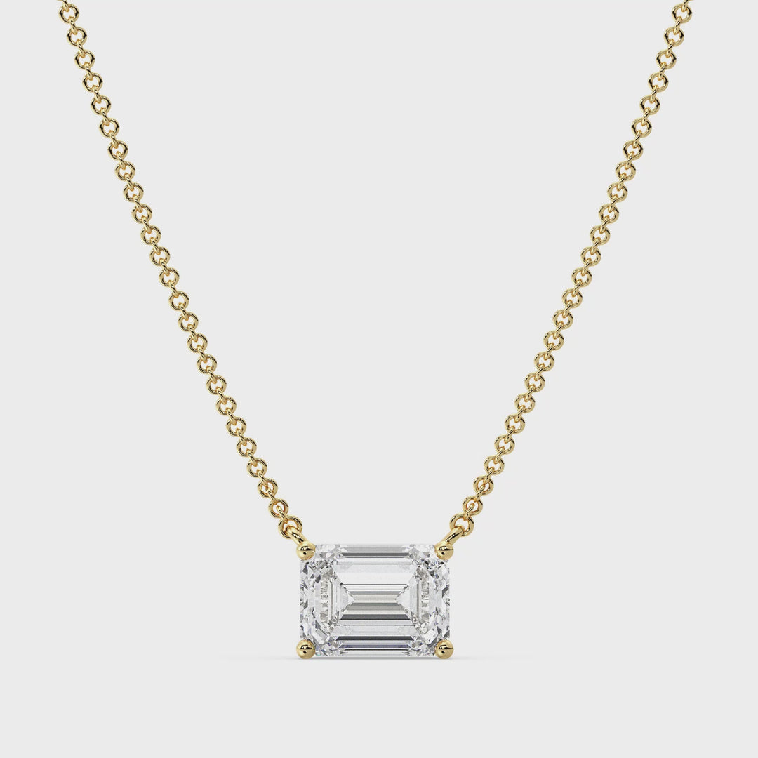 ideo showcasing a 2.00 Carat Lab-Grown Emerald-Cut Diamond Solitaire Pendant Necklace in 18K Yellow Gold. The pendant features a dazzling emerald-cut diamond in a classic prong setting, suspended from a sleek yellow gold chain. The video highlights the pendant's brilliance, clarity, and exceptional craftsmanship, making it a timeless and elegant accessory