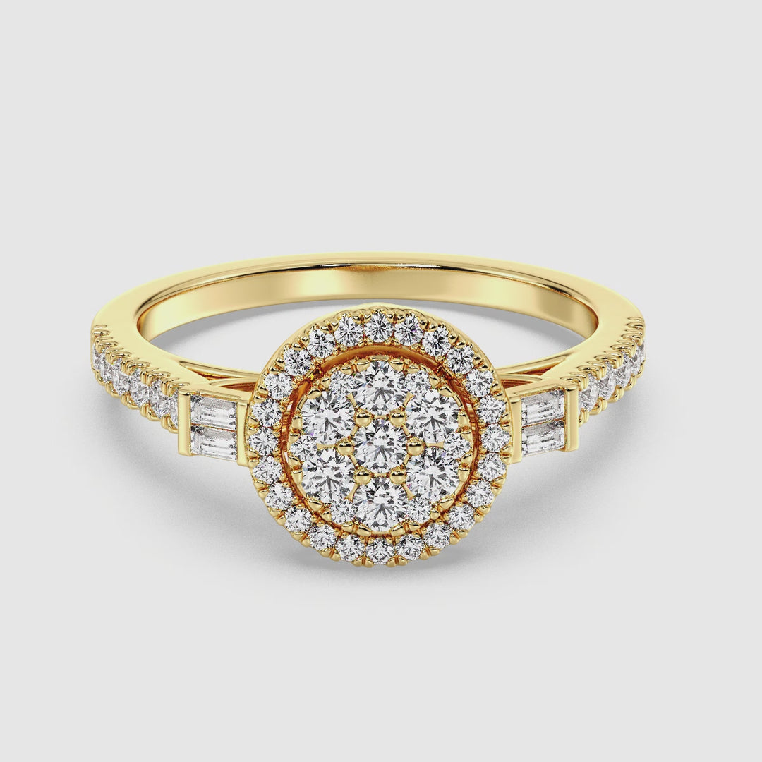 A close-up video showcasing the Yellow Gold variant of a 0.74 CTTW Lab-Grown Diamond Round Cluster Halo Engagement Ring. The dazzling EF color diamonds with VS clarity sparkle brilliantly in the light, arranged in a round cluster halo design. The warm, radiant 18K Yellow Gold band enhances the elegance of the diamonds, highlighting the intricate craftsmanship and luxurious appeal of the ring. Perfect for proposals, this ring symbolizes timeless love and sustainability.