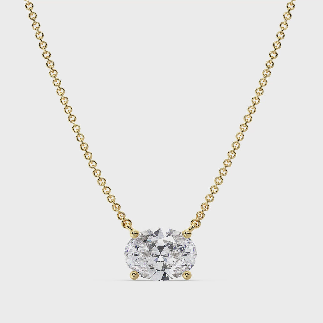 Close-up video of a 2.00 Carat Oval Lab-Grown Diamond Solitaire Necklace in 18K Yellow Gold, showcasing the IGI-certified diamond's brilliance and clarity in a classic prong setting, elegantly paired with a delicate yellow gold chain.