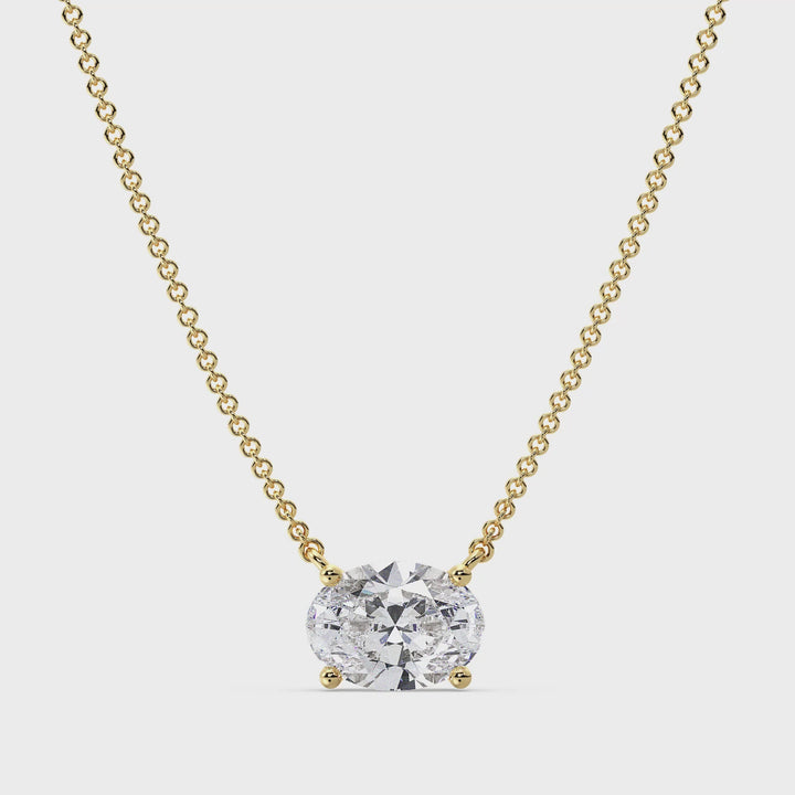 Close-up video of a 2.00 Carat Oval Lab-Grown Diamond Solitaire Necklace in 18K Yellow Gold, showcasing the IGI-certified diamond's brilliance and clarity in a classic prong setting, elegantly paired with a delicate yellow gold chain.