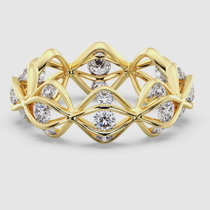 Close-up video of a Lab-Grown Diamond Eternity Wedding Band in 18K Yellow Gold, featuring 24 sparkling round-cut diamonds totaling 1.60 carats. The continuous line of diamonds shines brilliantly, symbolizing eternal love, with the warm yellow gold band adding a timeless and elegant touch.